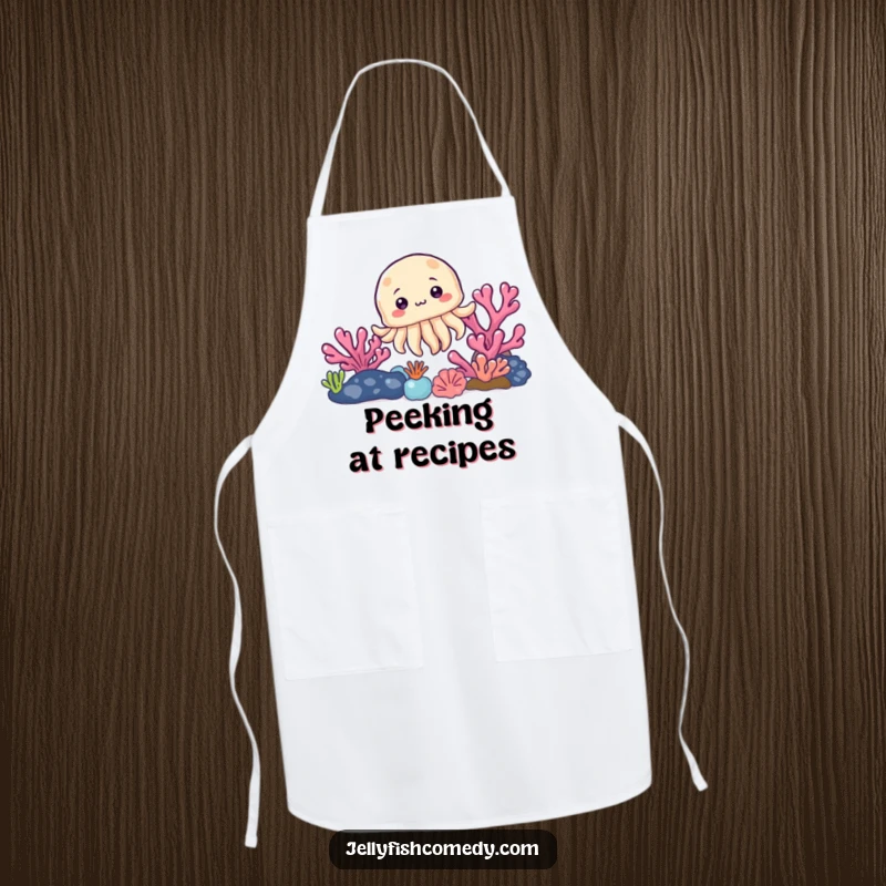 Funny apron with a curious jellyfish peeking from behind a vibrant coral reef, ready for kitchen duties with a playful twist.