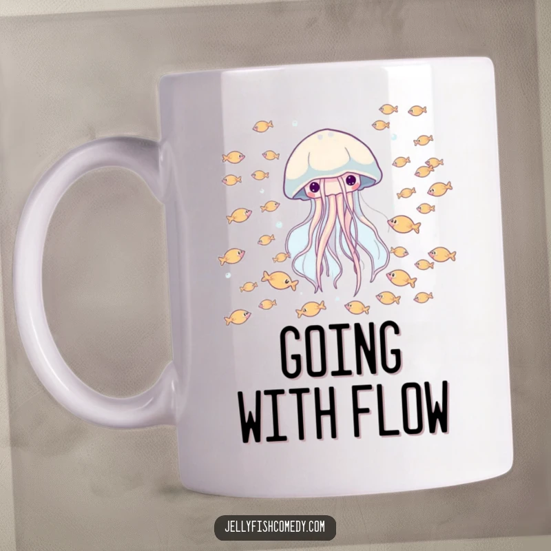 Funny mug showing a happy jellyfish drifting peacefully through a school of tiny fish, celebrating marine life.