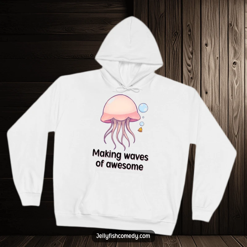 Funny jellyfish hoodie, showing a sea creature playfully bouncing a small bubble, perfect for cozying up with a humorous ocean vibe.