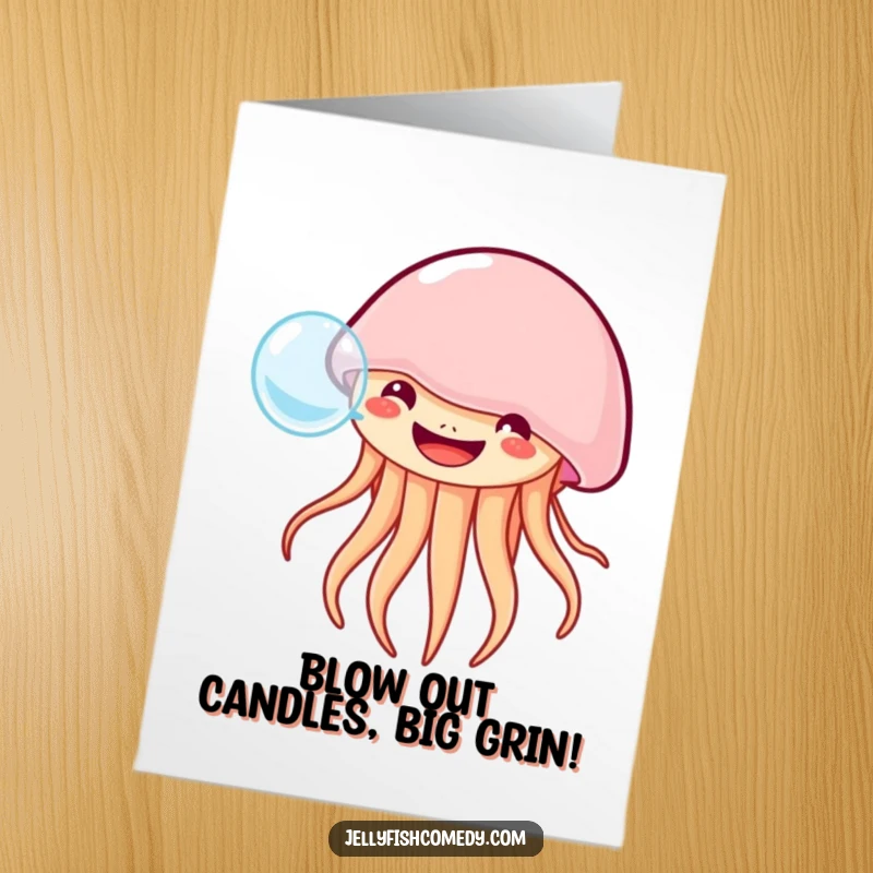 Free printable birthday card featuring a jellyfish with a wide grin blowing a single large bubble, conveying pure joy.