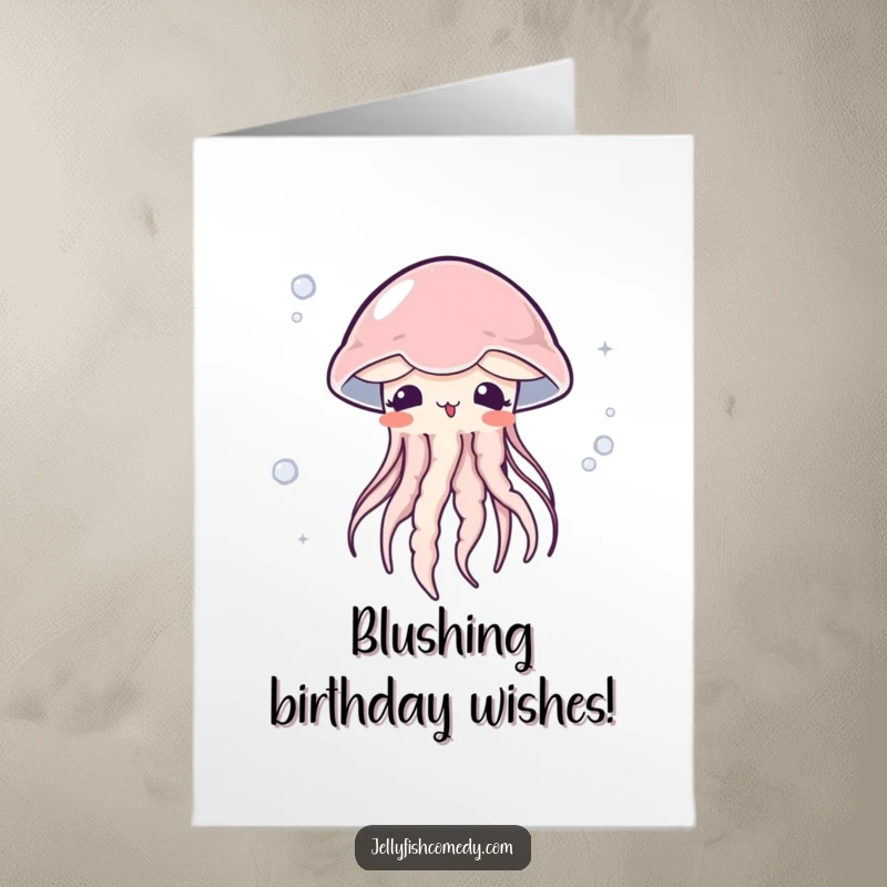Free printable birthday card featuring a jellyfish blushing with surprise while floating in a gentle current, a sweet and unexpected design.