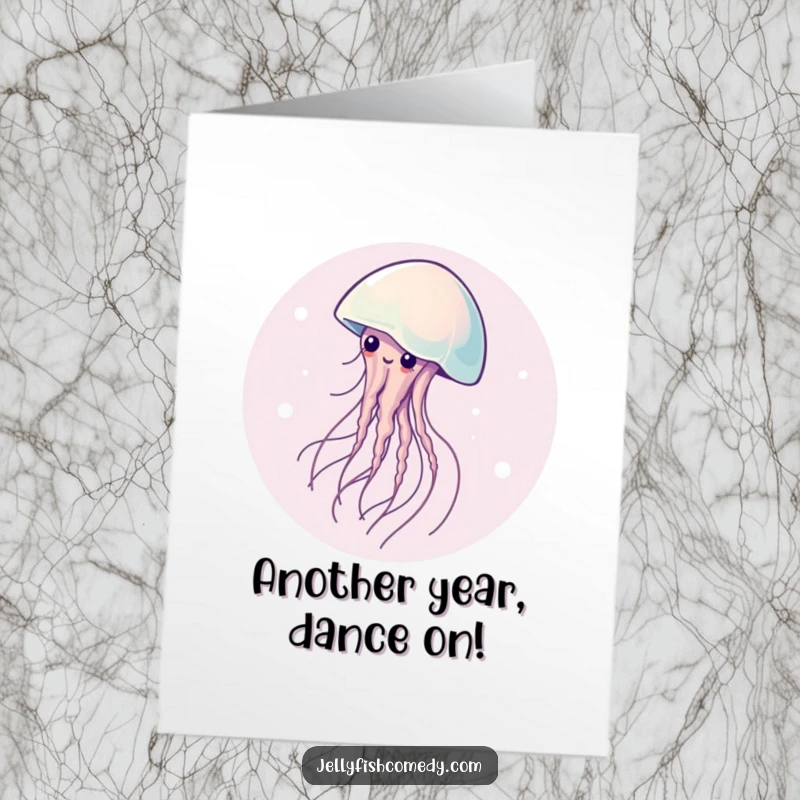 Free Printable Birthday Card: A graceful jellyfish elegantly spinning in a circle, adding a touch of serene fun.