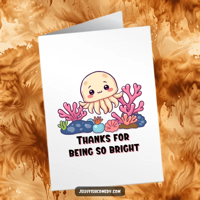 Funny Free Printable Thank You Card: A curious little jellyfish peeks from behind a colorful coral reef, conveying thanks with a smile.