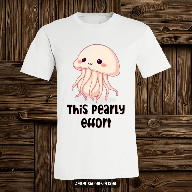 T-shirt depicting a determined jellyfish straining to push an oversized pearl, embodying effort and unwavering resolve.