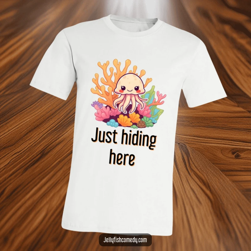 Funny Jellyfish T-Shirt: A whimsical jellyfish playfully peeks from behind a vividly colored coral formation.